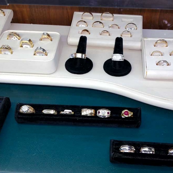 various types of rings for sale in a display case