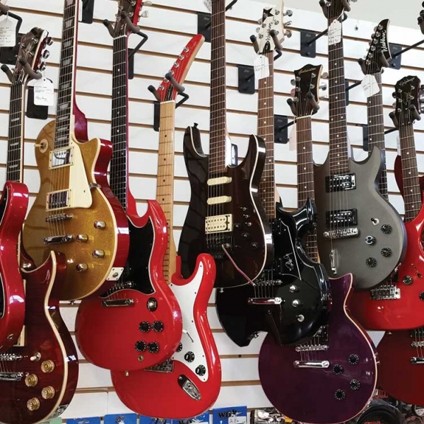 Electric Guitars Mounted On Shop Wall